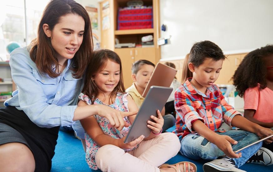 An education major student teaching with elementary students